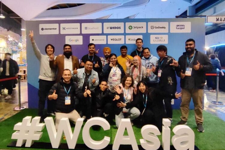 A big group photo at the WordCamp Asia after party, with experts and staff posing behind the #WCAsia sign. Samuel, Farooq, Ganga, Simrandeep, Arpit, Xaver, Surendra, Samuel, Mobeen, Valerii, Bijay, Meher, Megan, Ali, Olga, and Olga's friend. Not pictured but off camera somewhere is Shanta! Whoops!