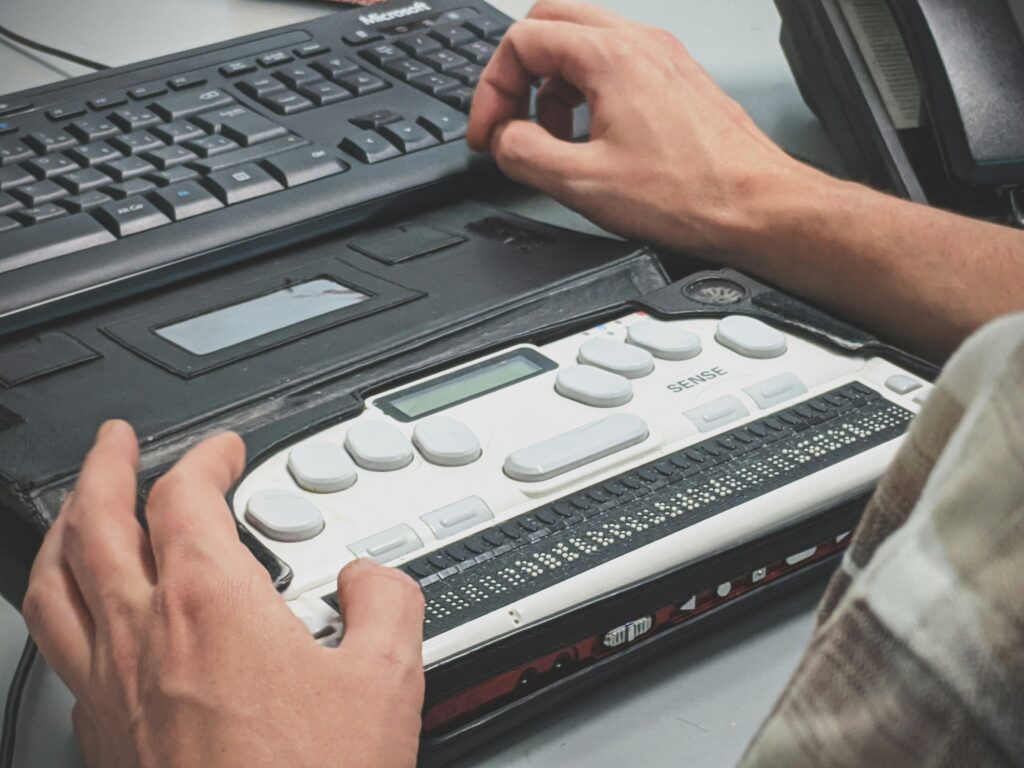 Person using a braille writer to access the internet | Source: Photo by Sigmund on Unsplash