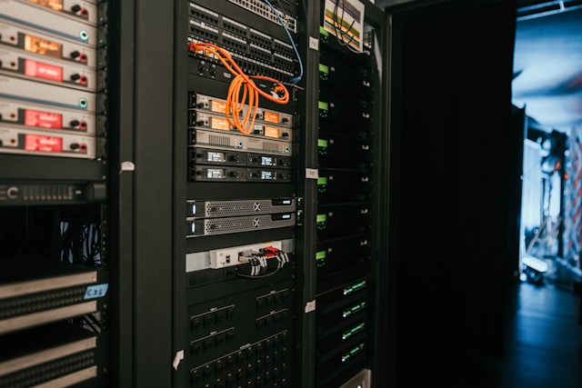 Image of a rack of servers in a server room | Source: Unsplash (Photo by Kevin Ache on Unsplash)